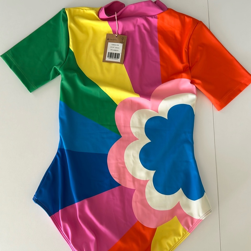 Adorable mini boat in one piece with zip back. New with tags size 13–14.